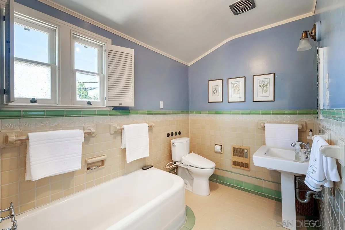 305 West Olive Street San Diego, CA 92103 - Photo 49 of 74 a bathroom with a sink a toilet and a window