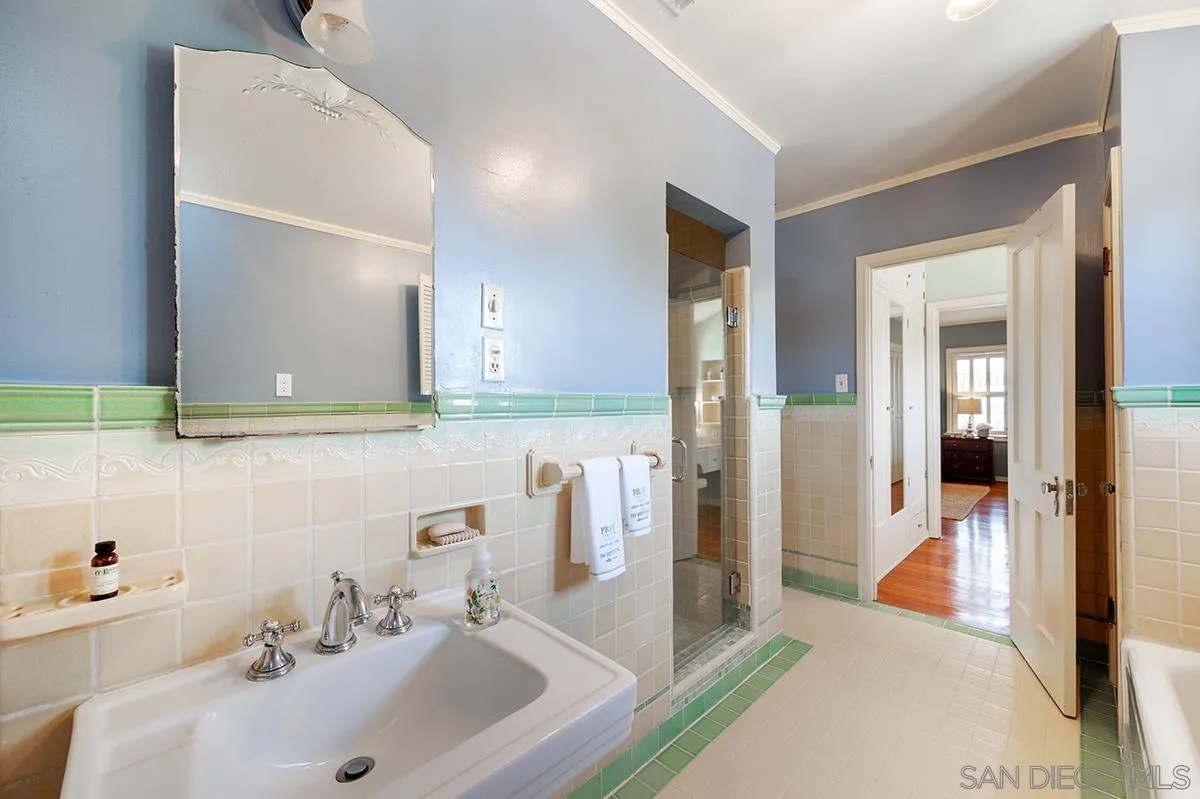 305 West Olive Street San Diego, CA 92103 - Photo 50 of 74 a en suite bathroom with a sink and a mirror