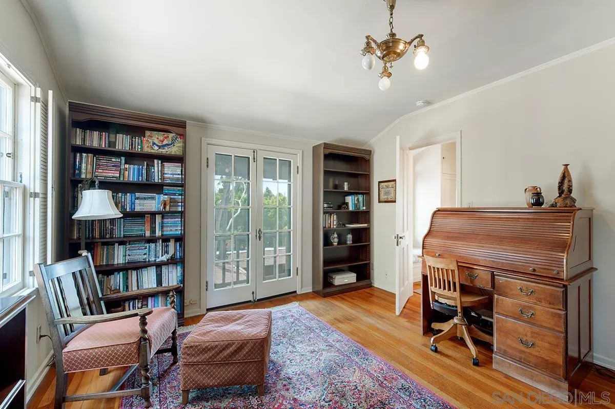 305 West Olive Street San Diego, CA 92103 - Photo 56 of 74 a living room with furniture a bookshelf and a window