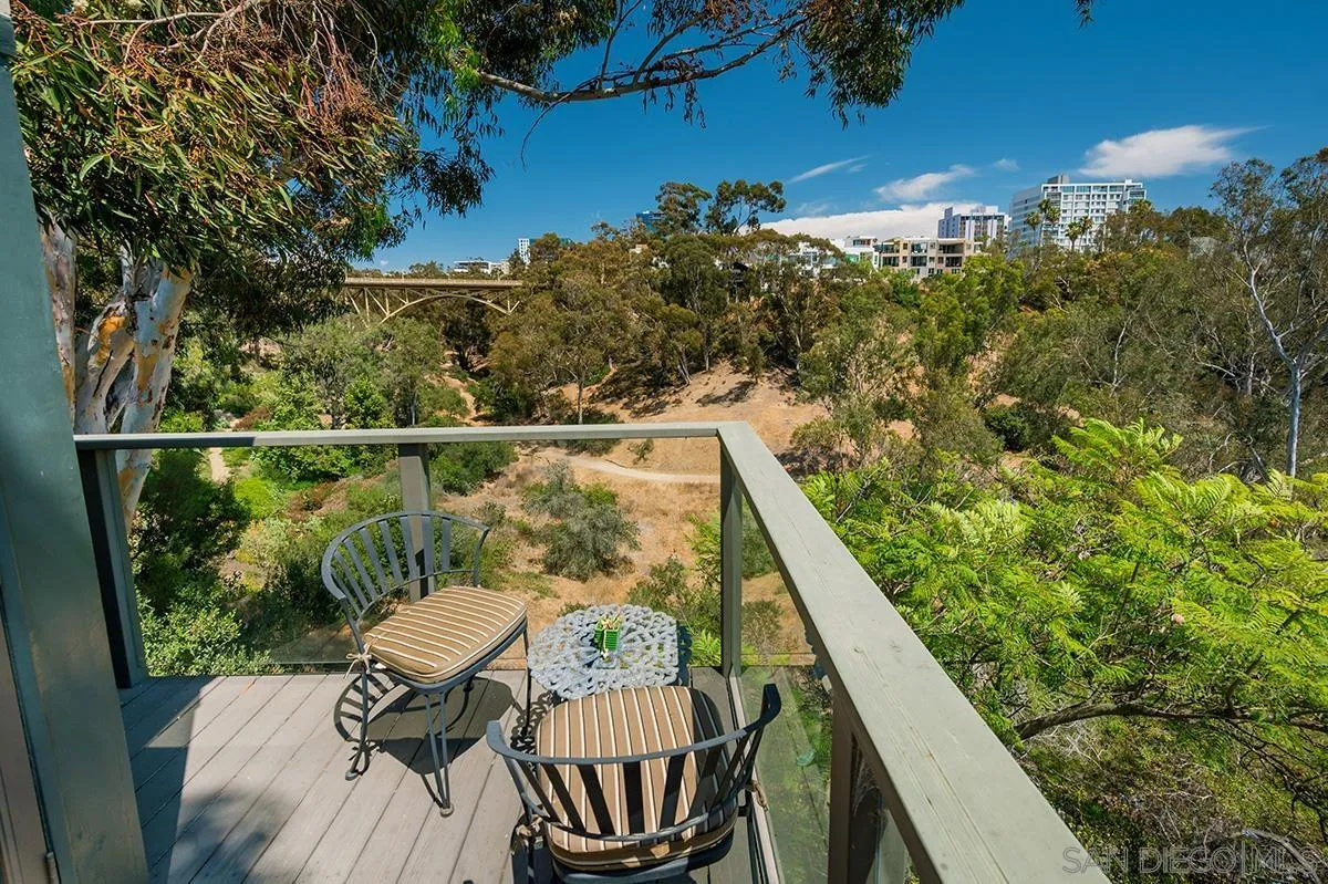 305 West Olive Street San Diego, CA 92103 - Photo 57 of 74 a view of a balcony with two chairs and a table
