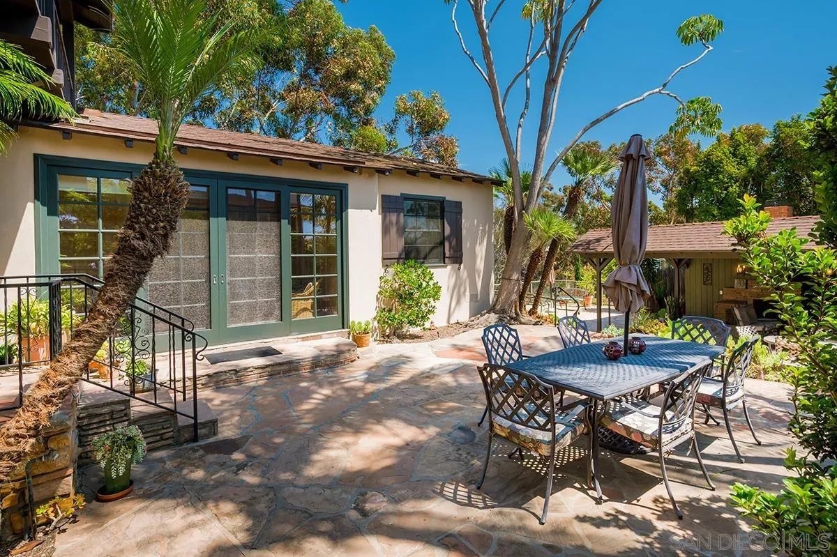 305 West Olive Street San Diego, CA 92103 - Photo 66 of 74 a view of a patio with table and chairs and potted plants