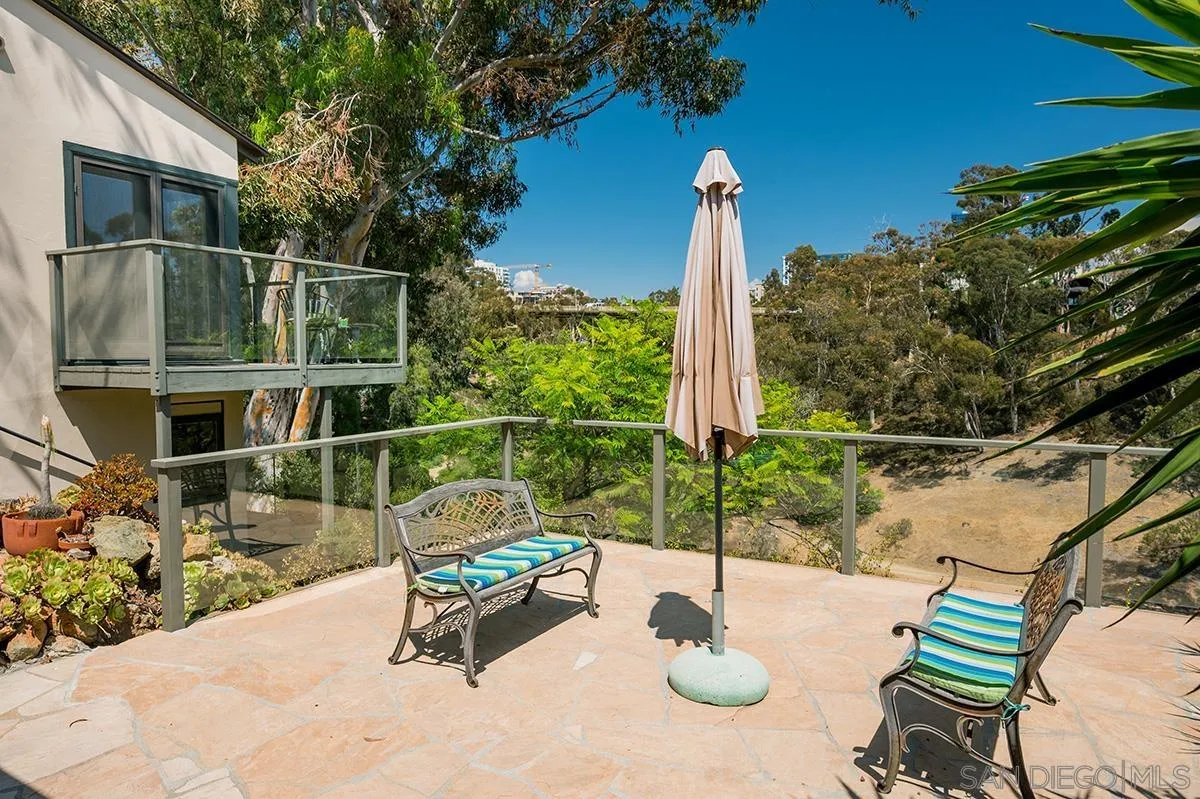305 West Olive Street San Diego, CA 92103 - Photo 68 of 74 a view of a chair and tables in the patio