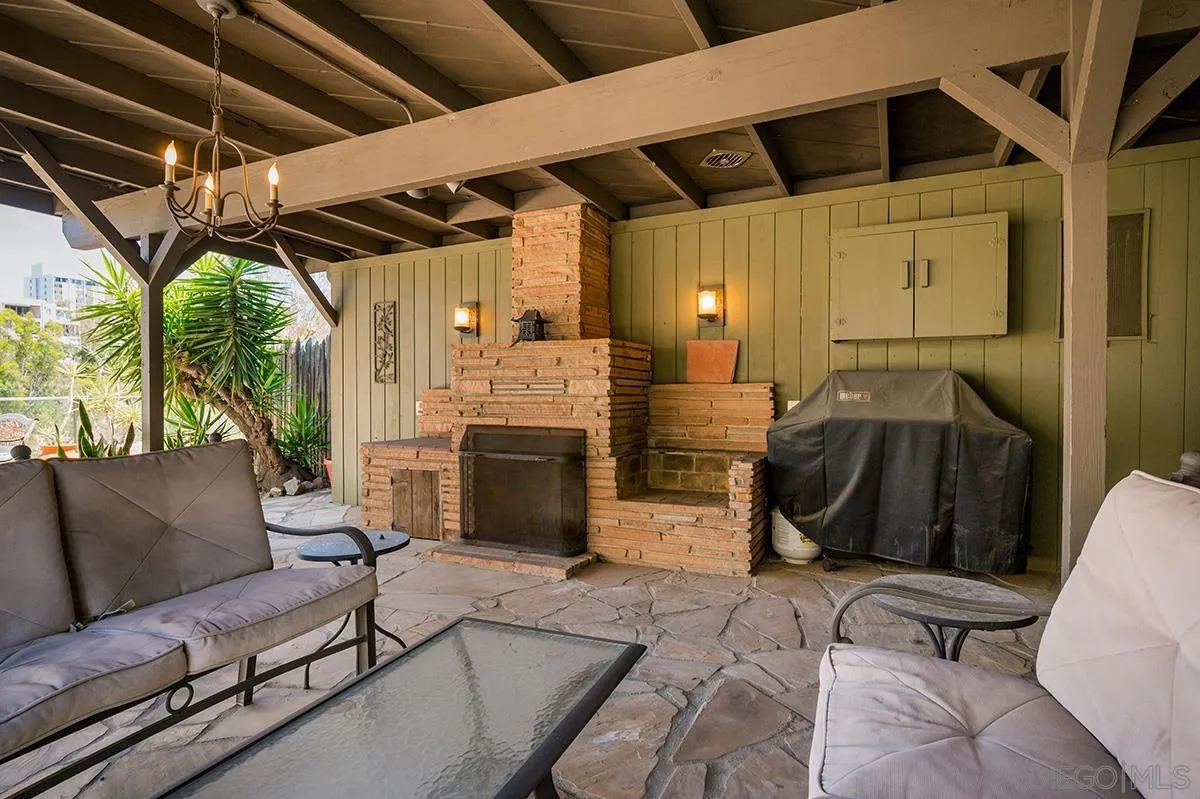 305 West Olive Street San Diego, CA 92103 - Photo 71 of 74 a view of a porch with furniture and a fireplace