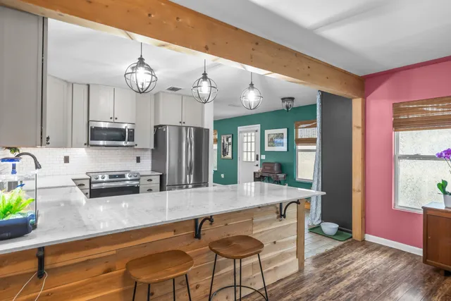 a living room with furniture and a rug