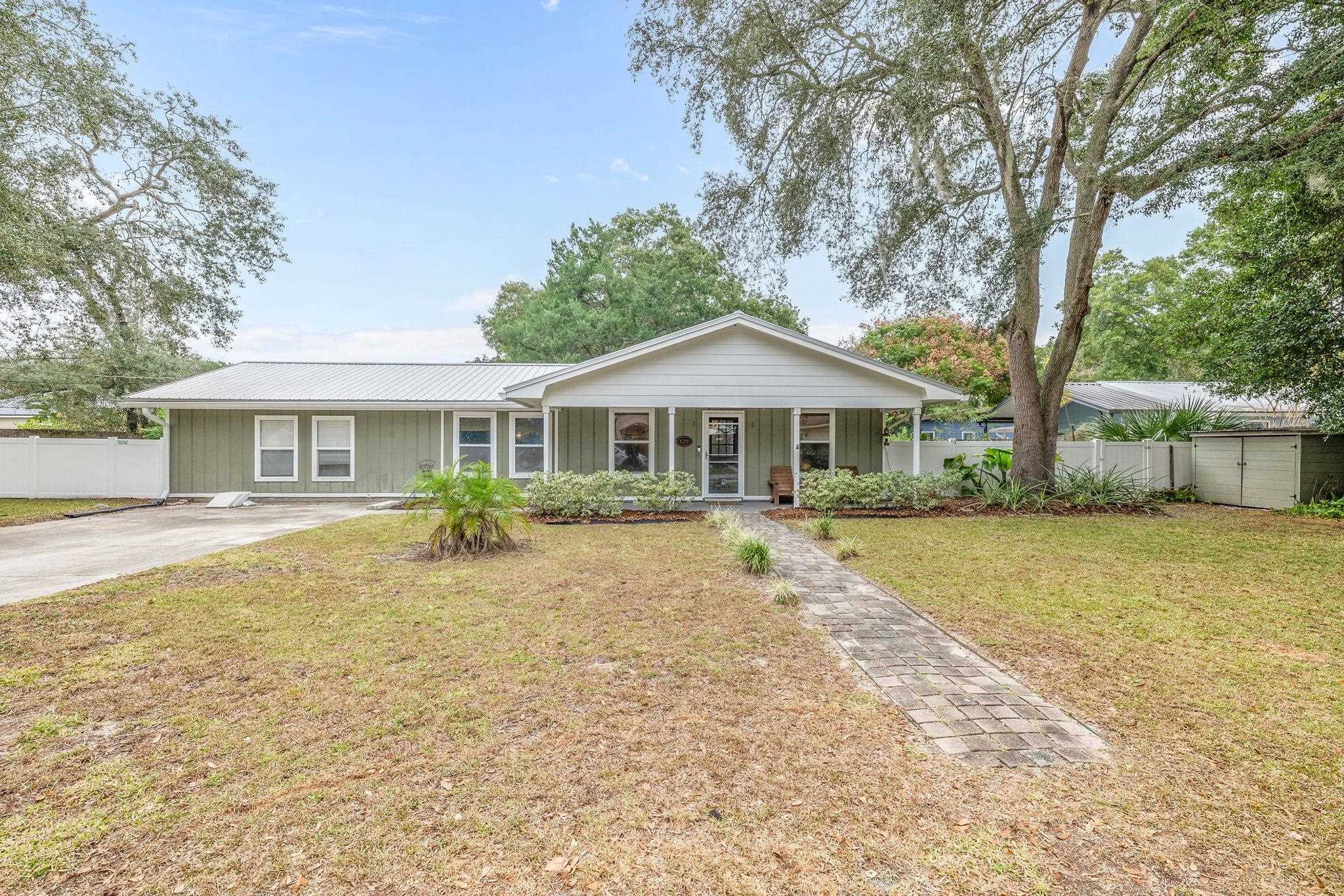 129 Pelican Road St. Augustine, FL 32086 - Photo 10 of 34 Ranch-style house with covered porch, a metal roof, and board and batten siding