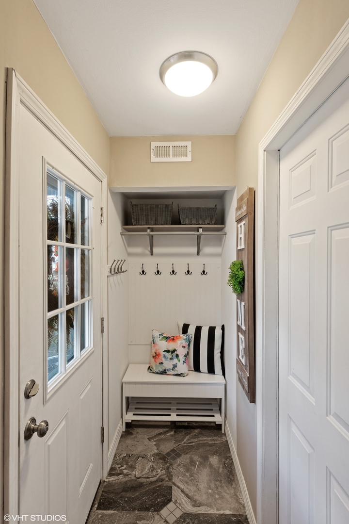 1675 Valley Forge Court, Unit A Wheaton, IL 60189 - Photo 2 of 11 a view of a bedroom with furniture and window