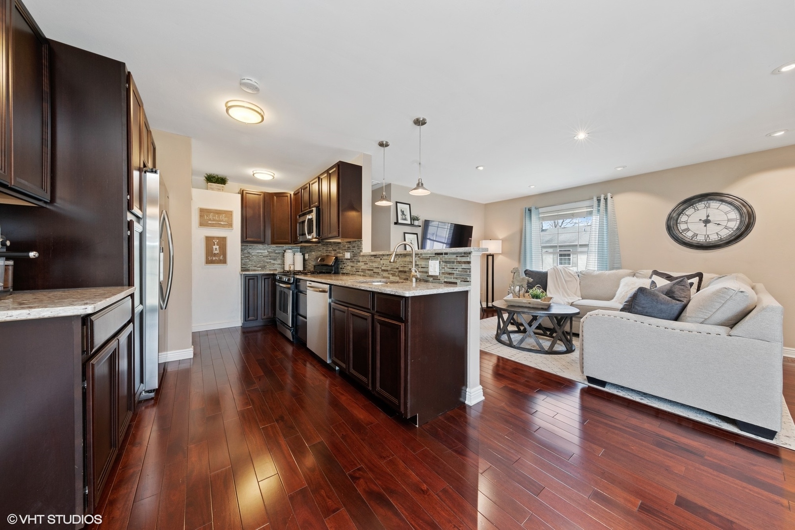 1675 Valley Forge Court, Unit A Wheaton, IL 60189 - Photo 3 of 11 a large kitchen with stainless steel appliances granite countertop a lot of counter space and wooden floor