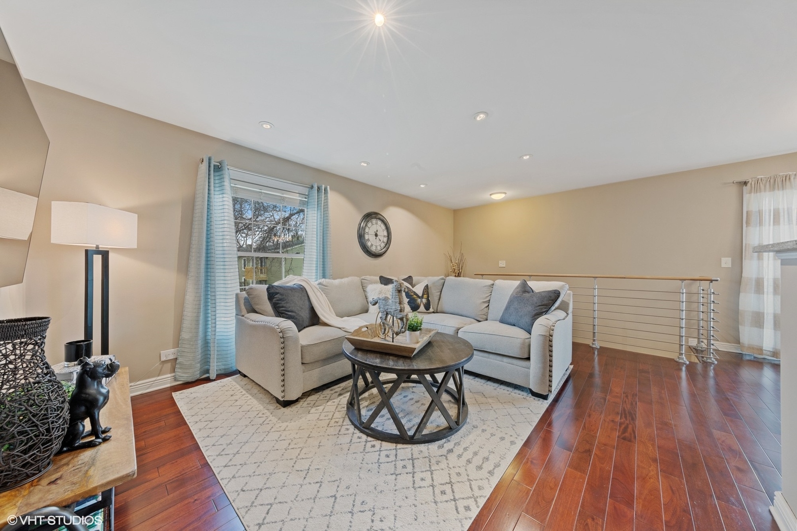 1675 Valley Forge Court, Unit A Wheaton, IL 60189 - Photo 5 of 11 a living room with furniture a wooden floor and a lamp