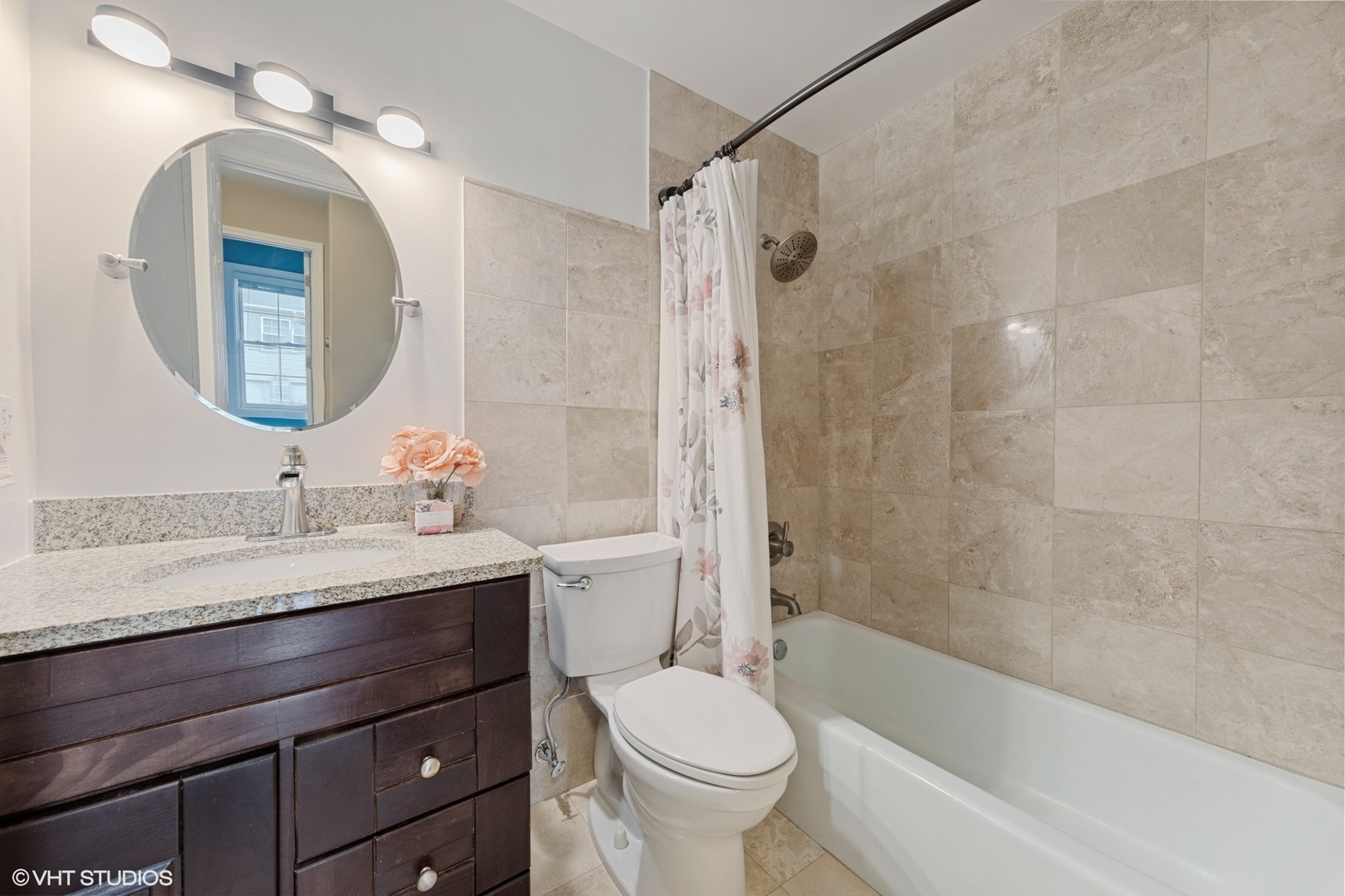 1675 Valley Forge Court, Unit A Wheaton, IL 60189 - Photo 8 of 11 a bathroom with a granite countertop sink toilet and shower