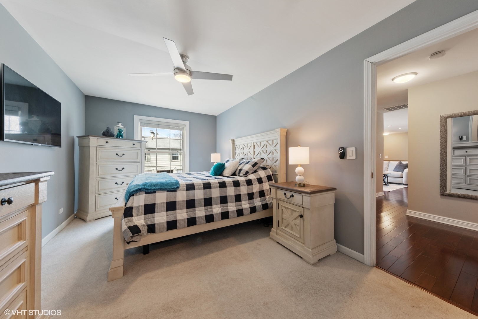 1675 Valley Forge Court, Unit A Wheaton, IL 60189 - Photo 9 of 11 a bedroom with furniture and a chandelier