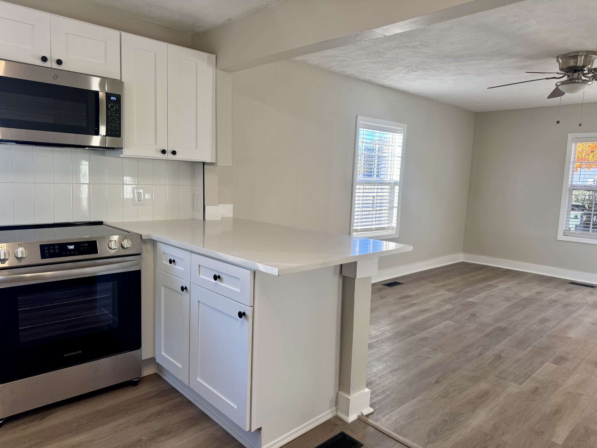 3163 Sunset Drive Springfield, TN 37172 - Photo 23 of 39 a kitchen with granite countertop cabinets stainless steel appliances and wooden floor
