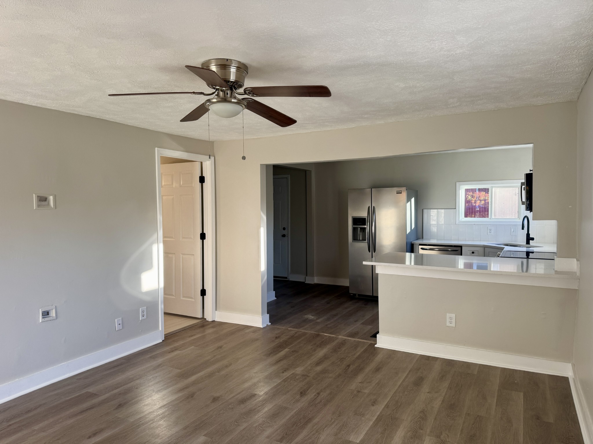 3163 Sunset Drive Springfield, TN 37172 - Photo 30 of 39 a view of a kitchen with a sink and cabinet with wooden floor