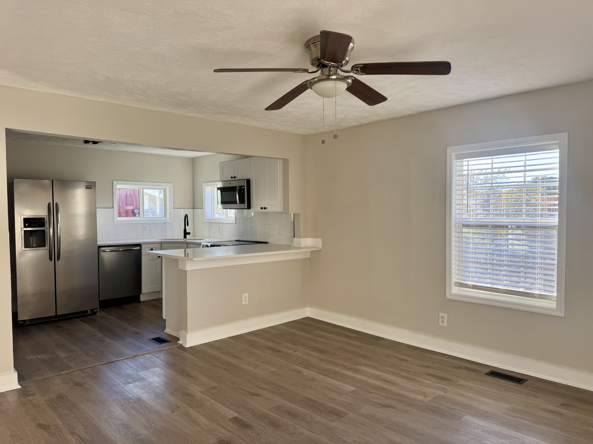 3163 Sunset Drive Springfield, TN 37172 - Photo 31 of 39 a view of a kitchen with a sink hardwood floor and a window
