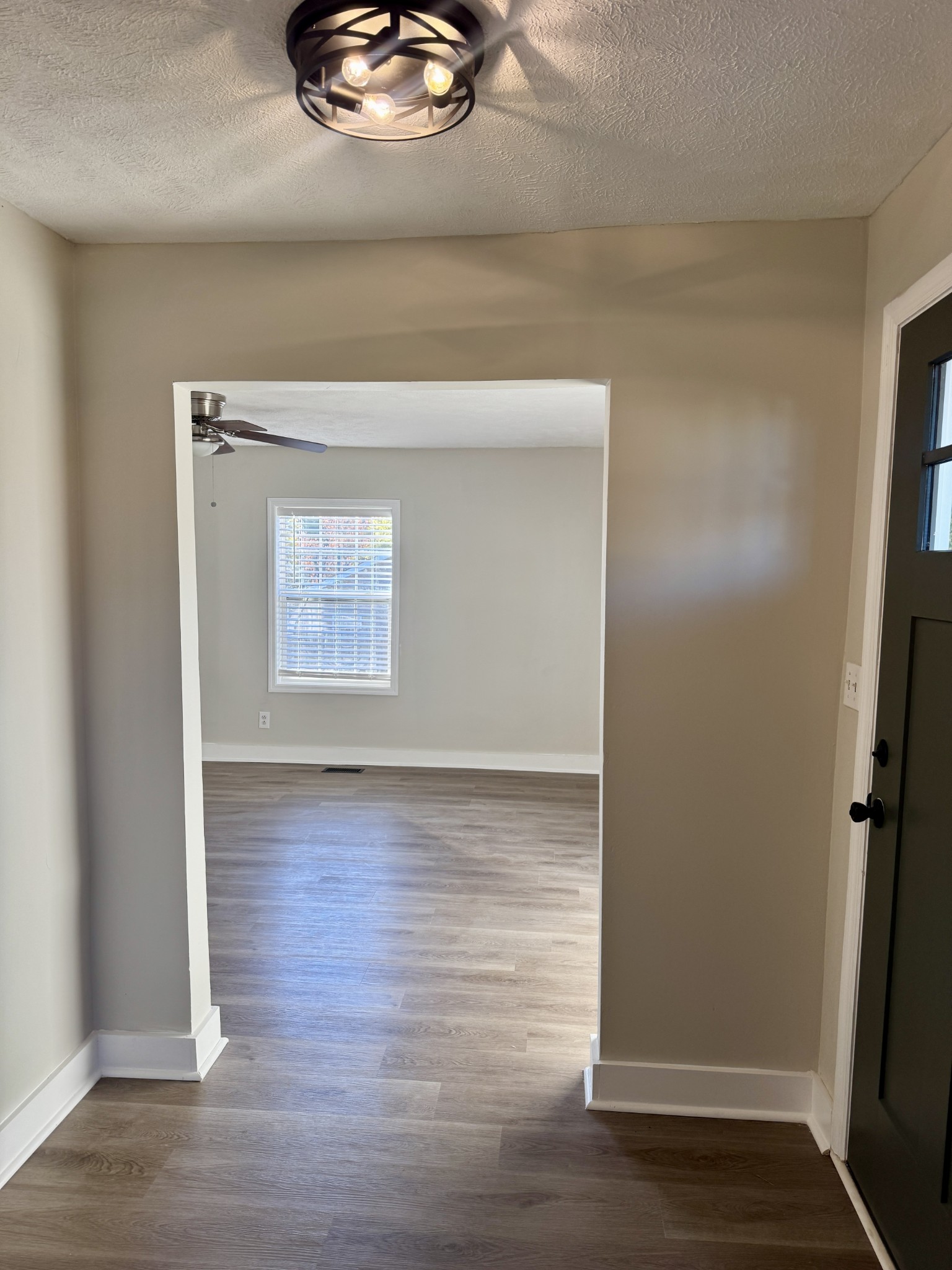 3163 Sunset Drive Springfield, TN 37172 - Photo 32 of 39 a view of an empty room with wooden floor and a window