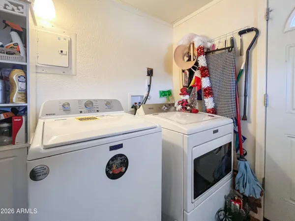 a view of a dining table and chairs in the patio