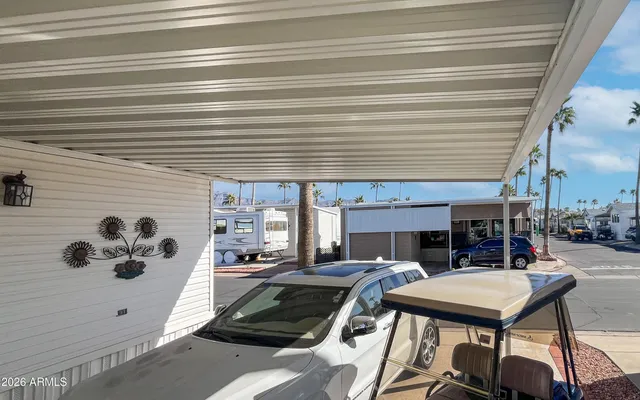 a view of balcony with two chairs
