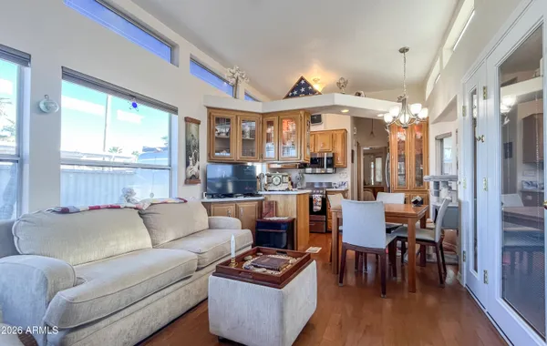 a living room with furniture and a kitchen