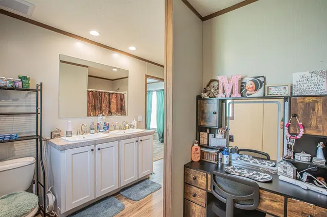 a view of bathroom with dual sinks