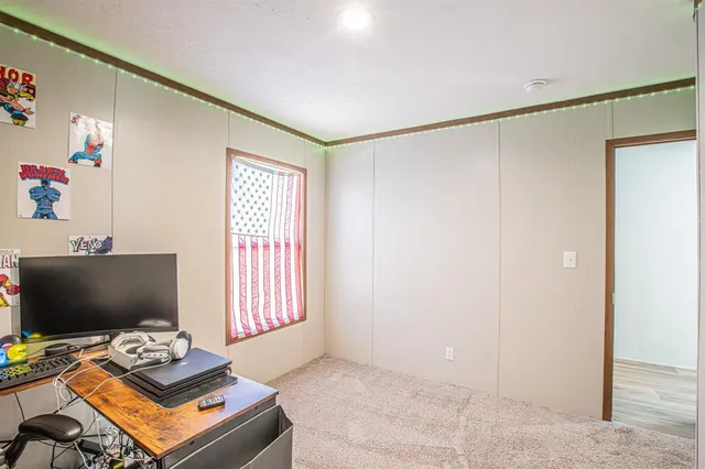 a workspace with furniture and window