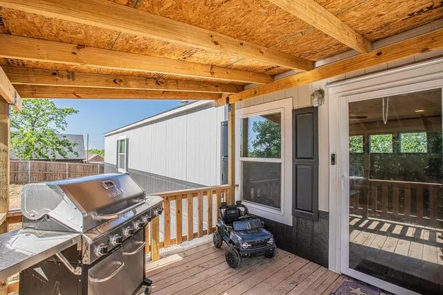 a view of a patio with wooden floor