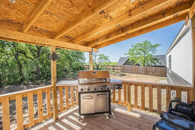 a view of a two chairs in the balcony
