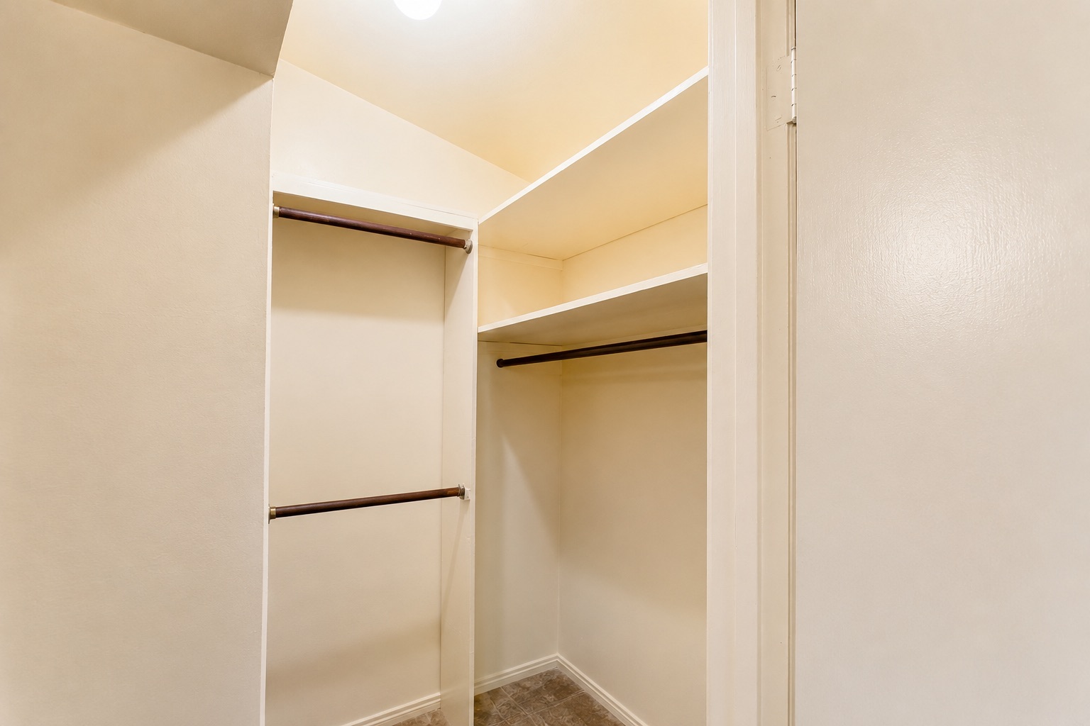 1508 Walnut Street Georgetown, TX 78626 - Photo 24 of 37 Functional organization with ample shelving and hanging space defines this closet interior.