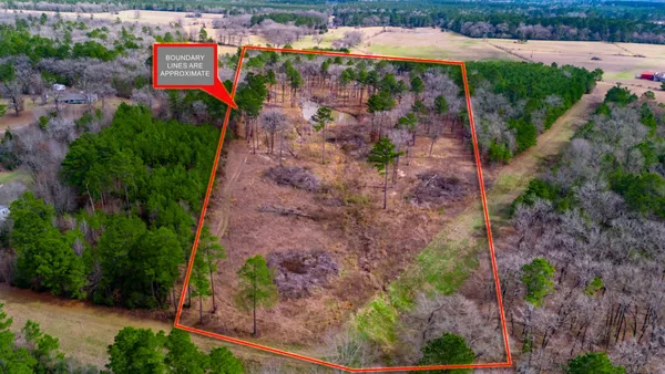 an aerial view of a houses with outdoor space