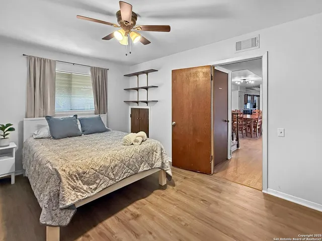 a bedroom with bed and window