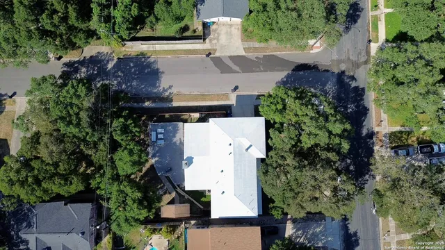 an aerial view of residential house with outdoor space
