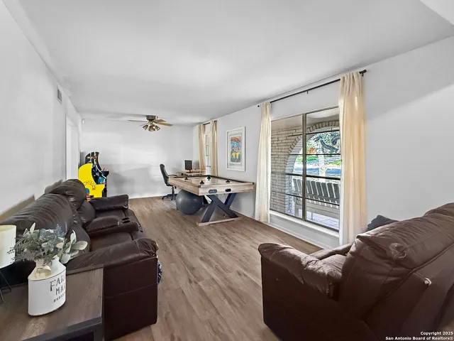 a living room with furniture and a window