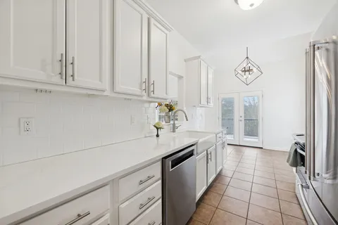 a kitchen with a sink and cabinets