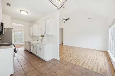 a view of a kitchen with electric appliances