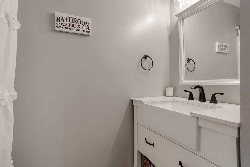 23 Balena Road Attleboro, MA 02703 - Photo 25 of 41 a view of bathroom with a sink and a mirror