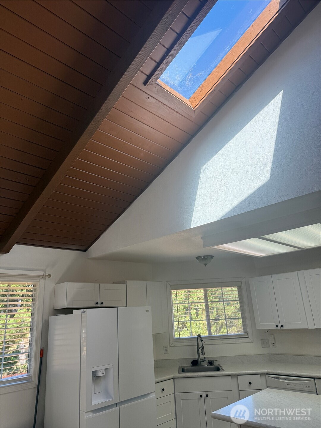 13208 Pacific Way Long Beach, WA 98631 - Photo 16 of 40 a kitchen with cabinets and window