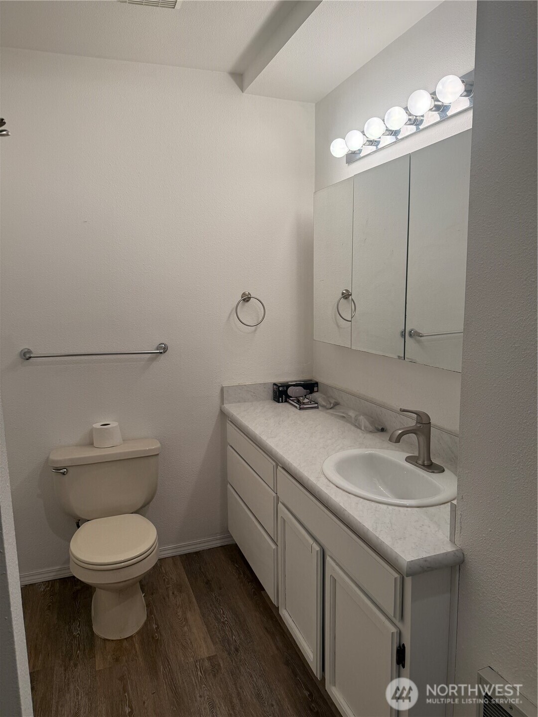 13208 Pacific Way Long Beach, WA 98631 - Photo 23 of 40 a bathroom with a toilet sink and mirror