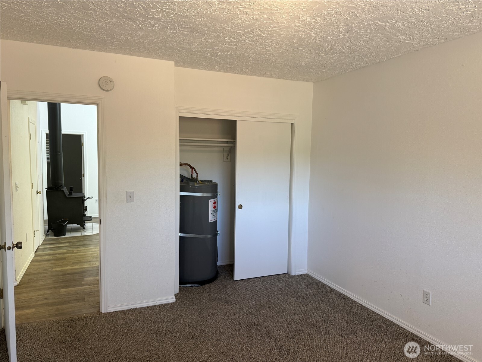 13208 Pacific Way Long Beach, WA 98631 - Photo 25 of 40 a view of a hallway with wooden shelves