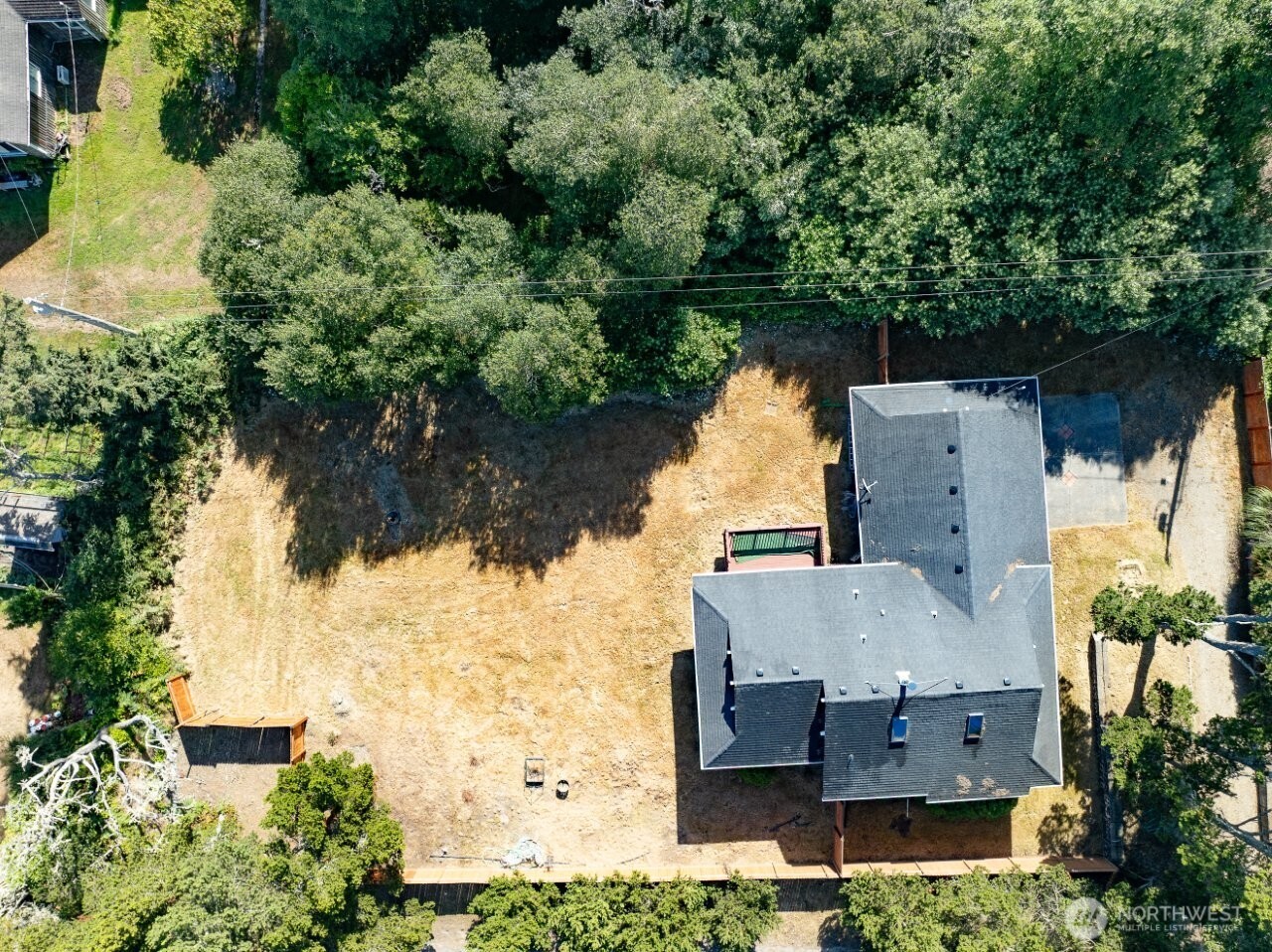 13208 Pacific Way Long Beach, WA 98631 - Photo 4 of 40 an aerial view of a house with a yard and lake view