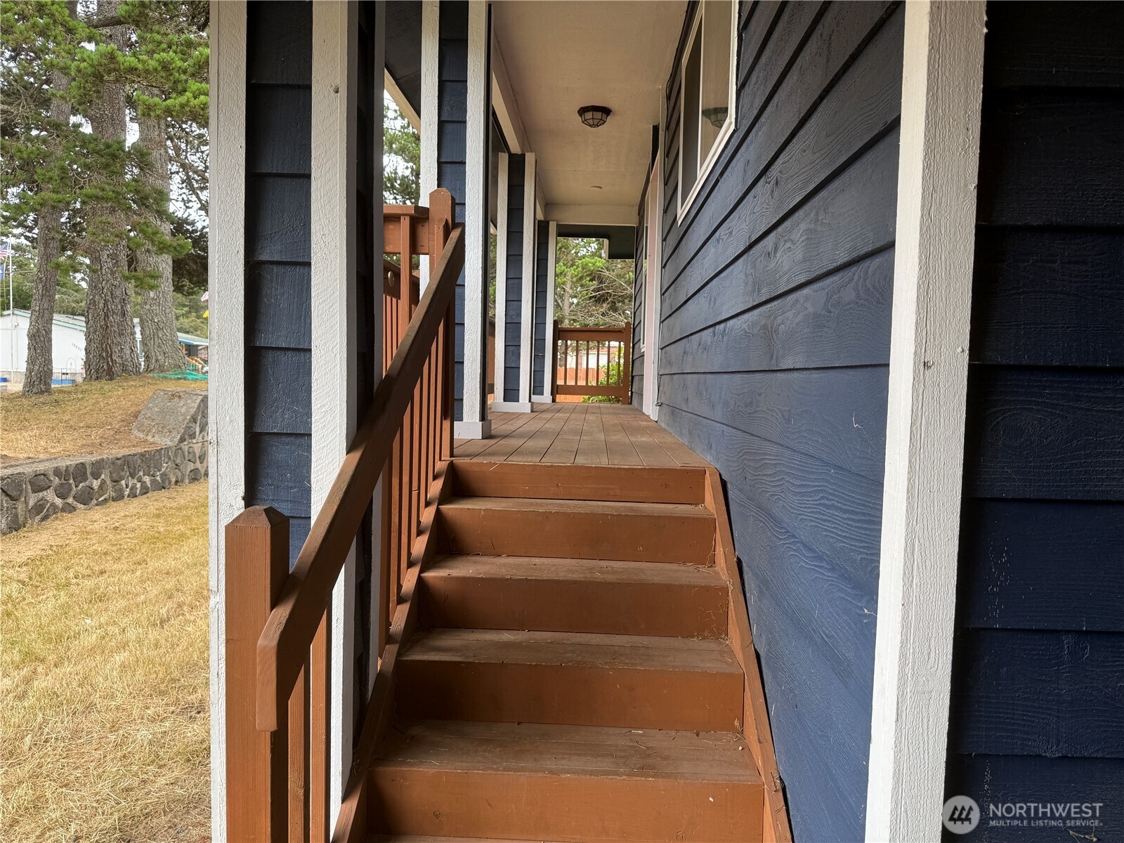 13208 Pacific Way Long Beach, WA 98631 - Photo 7 of 40 a view of staircase with lots of frames on wall