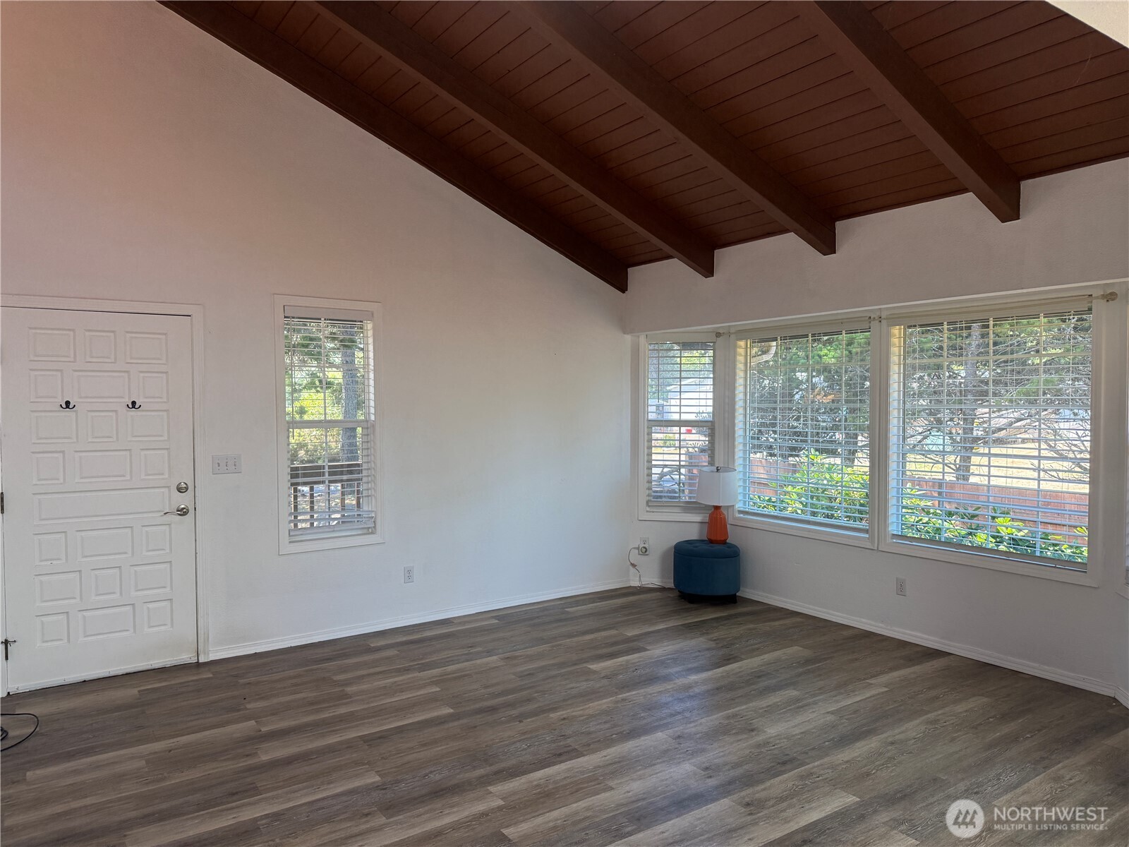 13208 Pacific Way Long Beach, WA 98631 - Photo 9 of 40 a view of empty room with wooden floor and windows