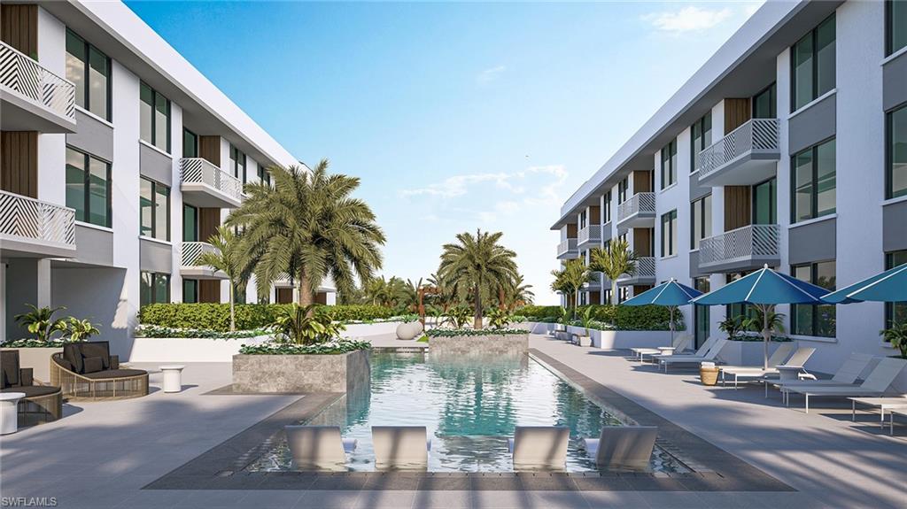 4936 Tamiami Trail East, Unit 319 Naples, FL 34113 - Photo 4 of 10 a view of multiple houses with yard and green space