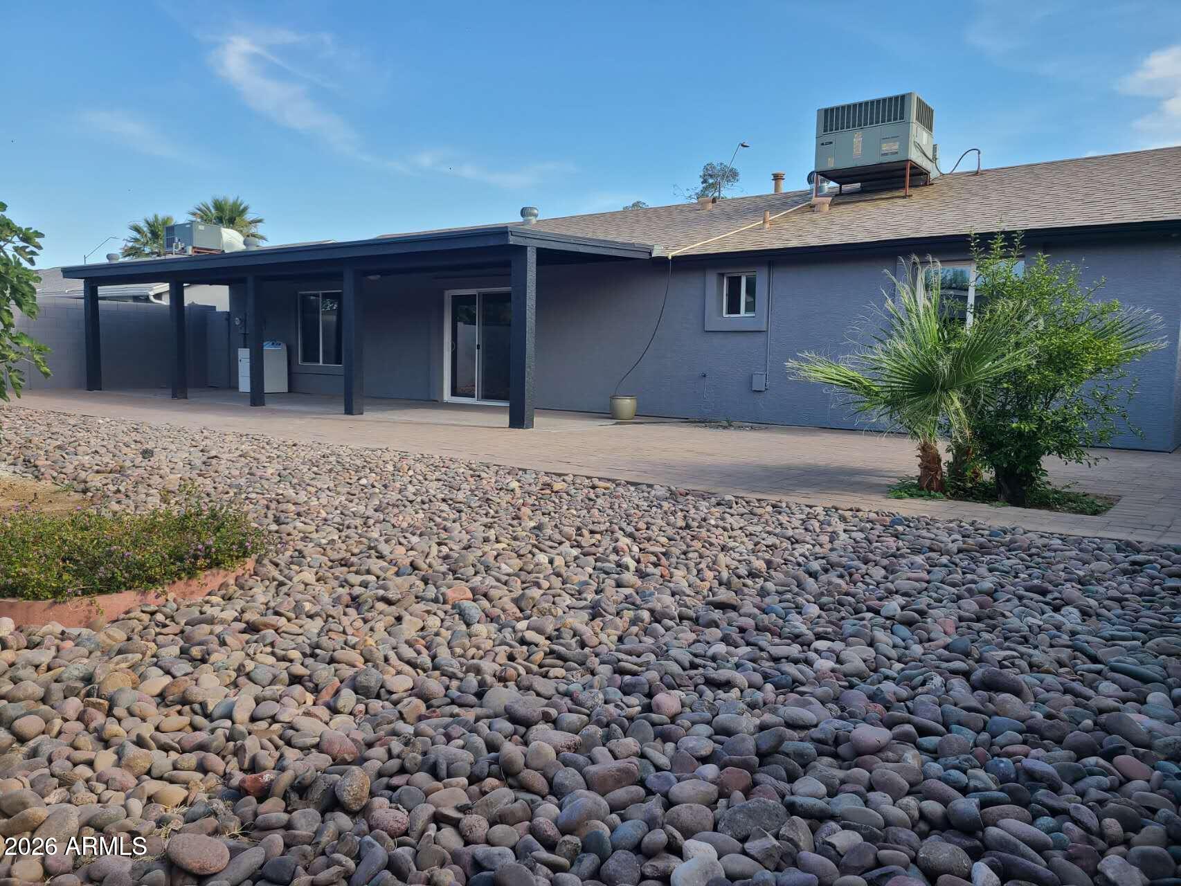 3702 East Thunderbird Road Phoenix, AZ 85032 - Photo 19 of 23 a front view of a house with a garden