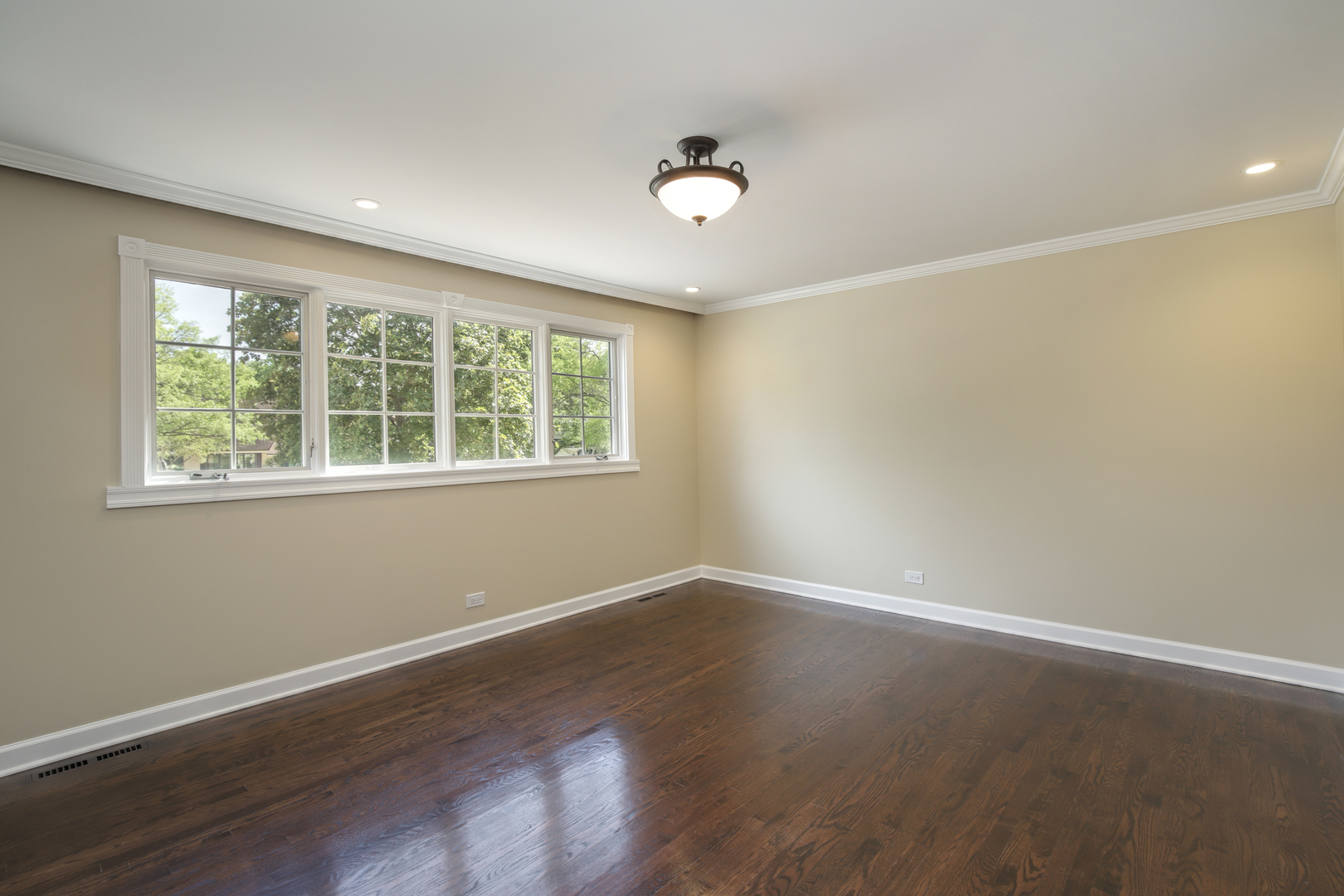 919 Suffield Terrace Northbrook, IL 60062 - Photo 10 of 13 a view of an empty room with wooden floor and a window