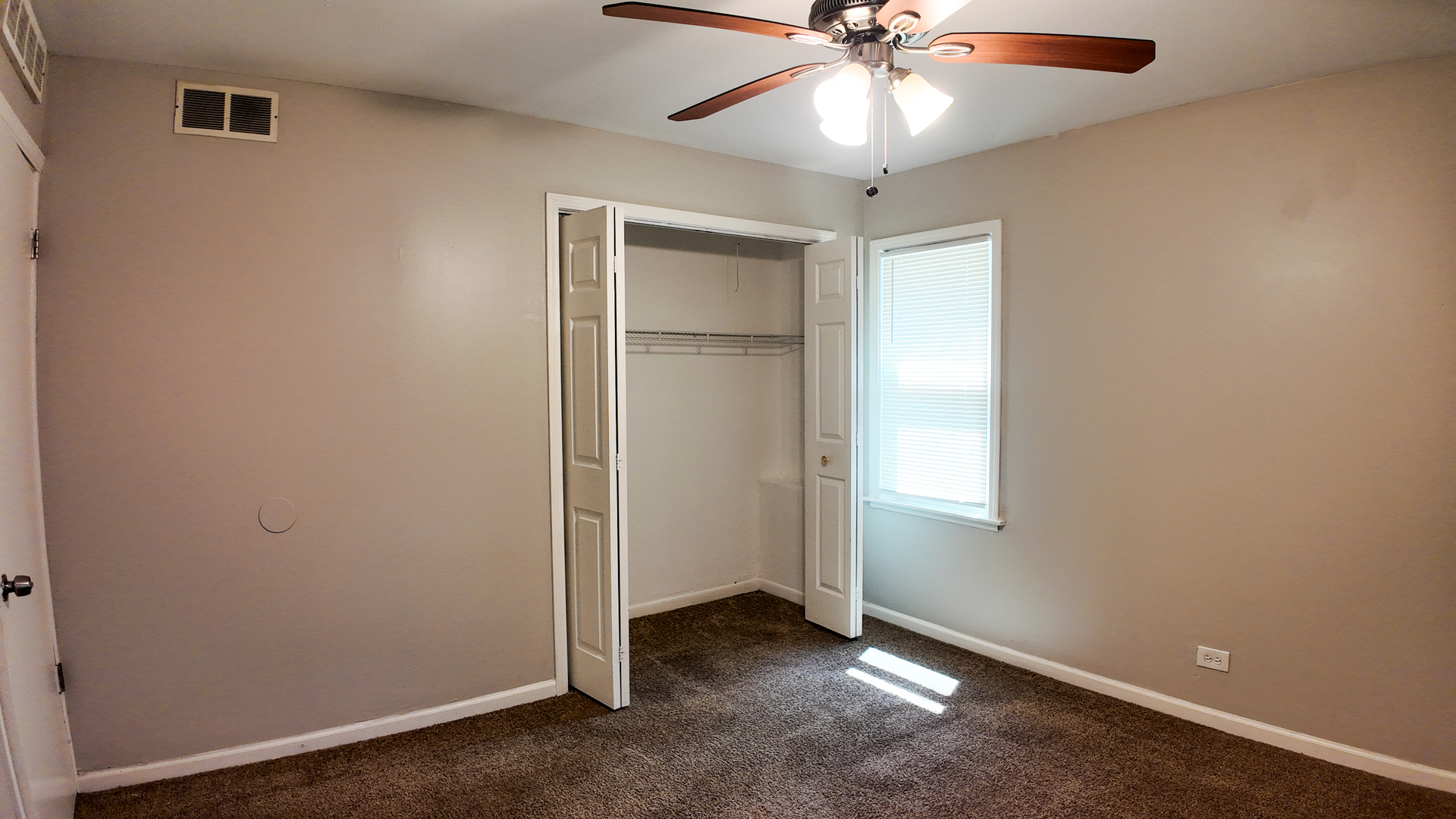 11604 South Kenneth Avenue Alsip, IL 60803 - Photo 17 of 26 an empty room with windows and fan