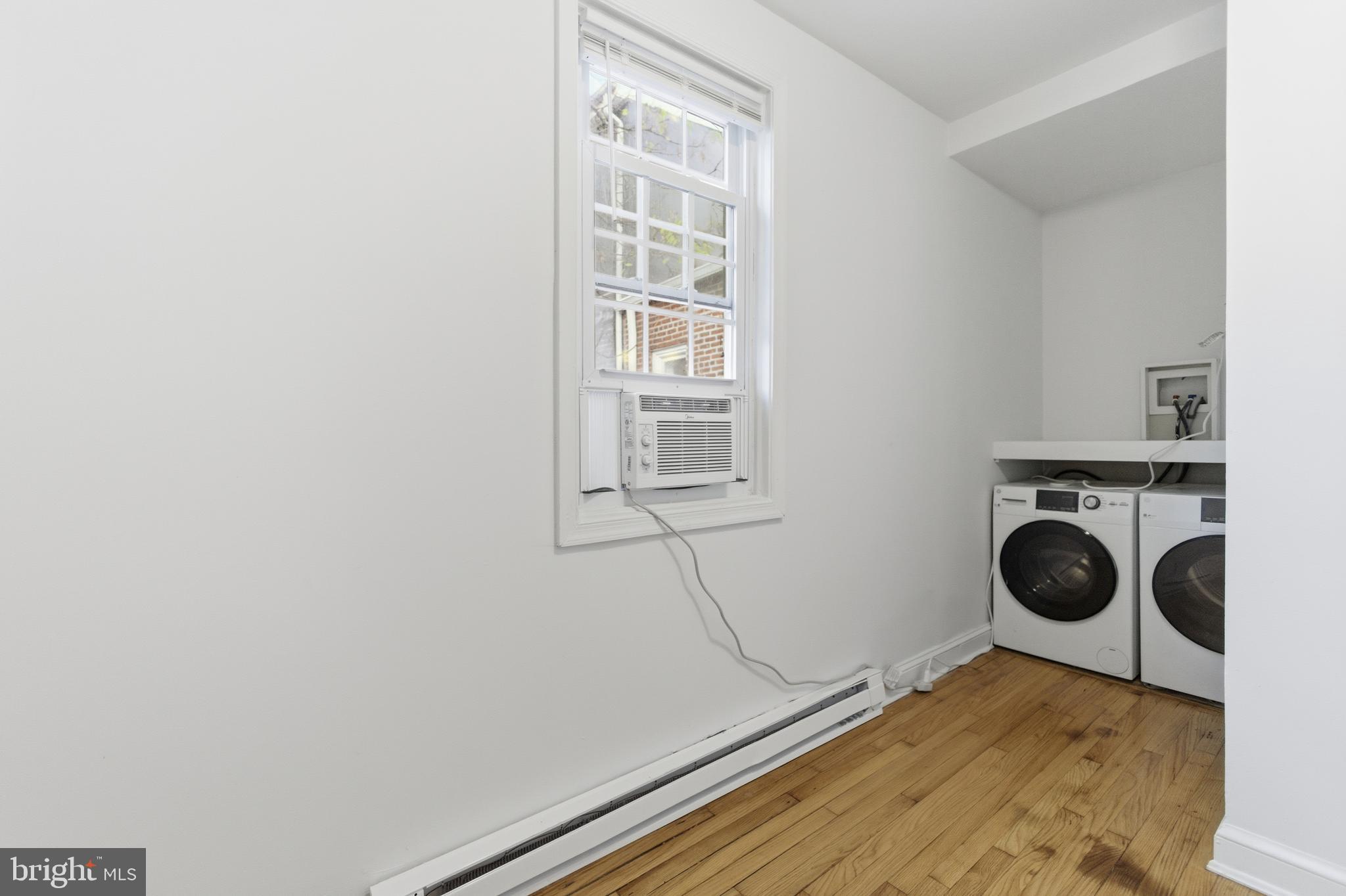 1226 F Street Northeast, Unit 3 Washington, DC 20002 - Photo 15 of 15 a view of a bedroom with a bed and a window