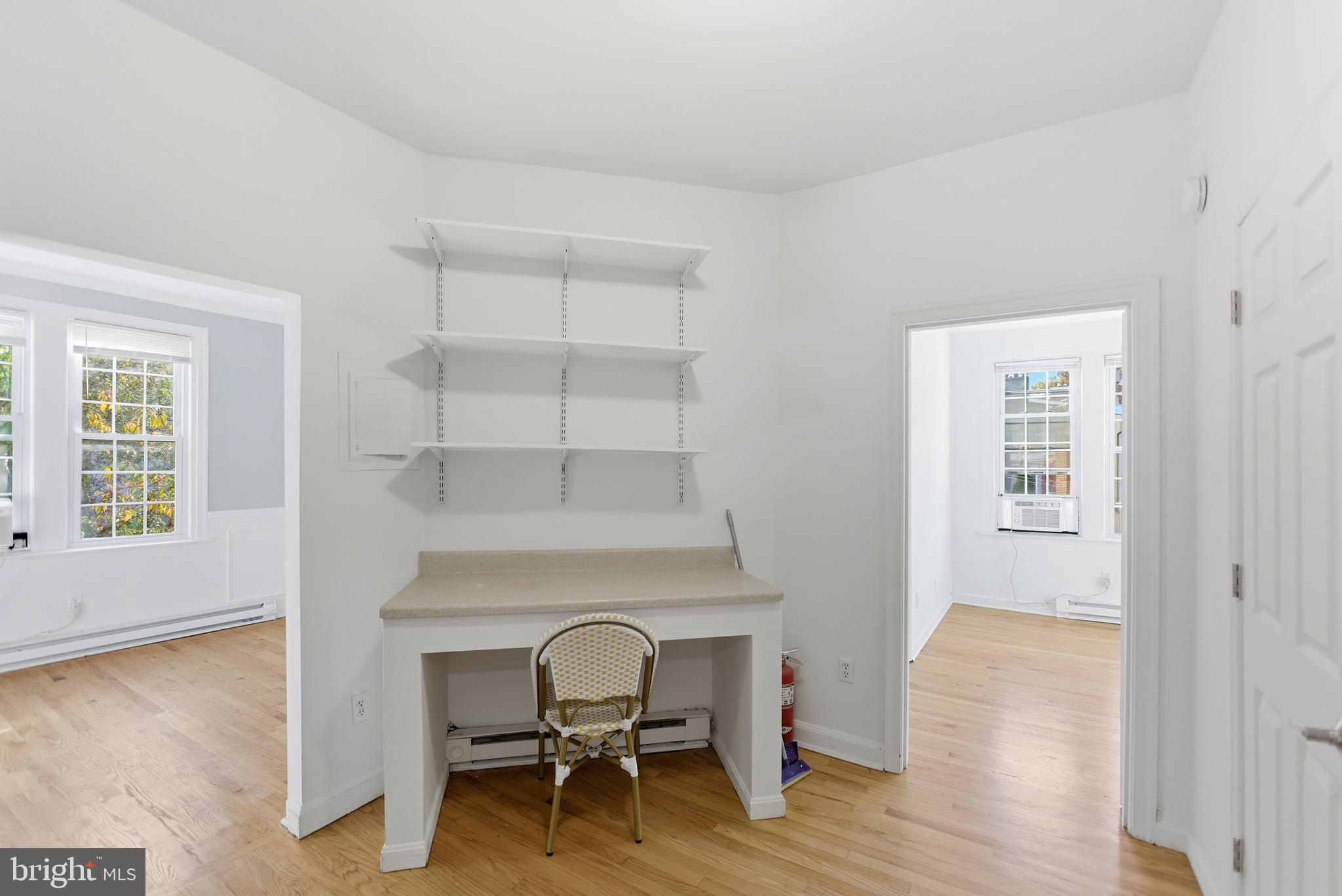 1226 F Street Northeast, Unit 3 Washington, DC 20002 - Photo 9 of 15 a view of a workspace with wooden floor and a window
