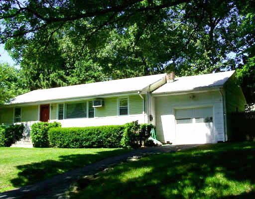 135 Alpine Street Stamford, CT 06905 - Photo 1 of 1 a front view of a house with a yard and garage