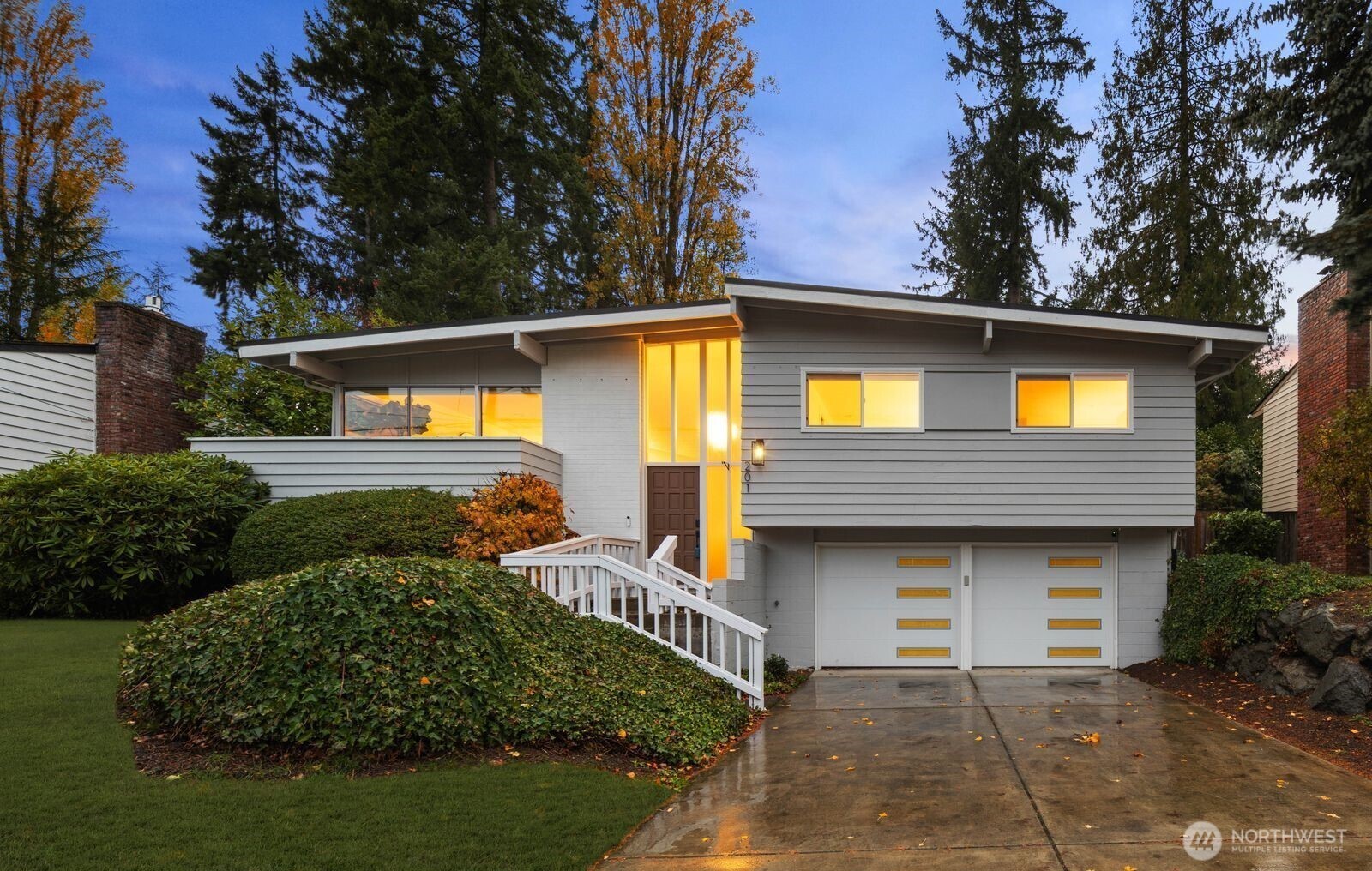 201 165th Avenue Northeast Bellevue, WA 98008 - Photo 1 of 13 a front view of a house with garden