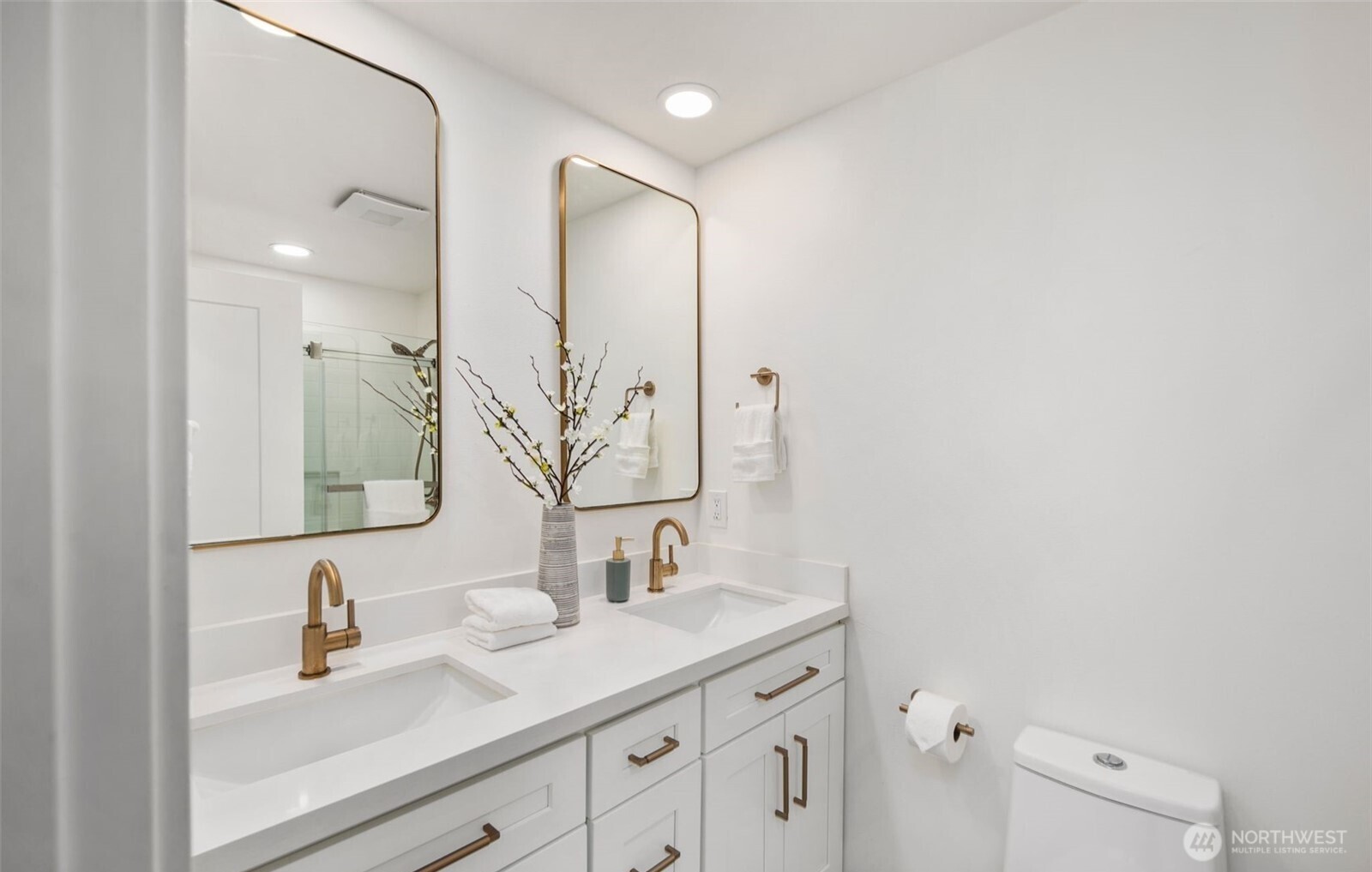 201 165th Avenue Northeast Bellevue, WA 98008 - Photo 11 of 13 a bathroom with a sink and a mirror