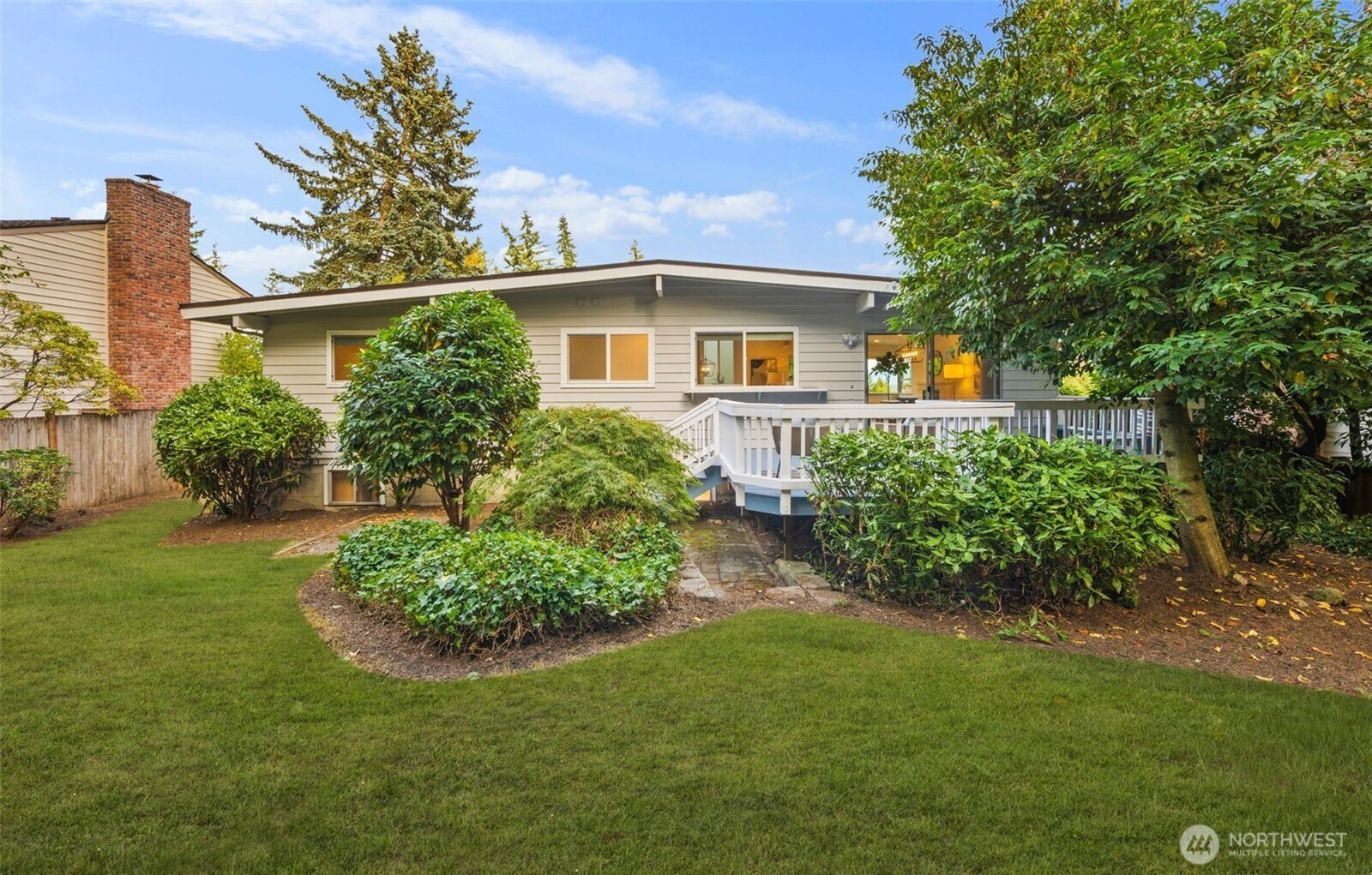 201 165th Avenue Northeast Bellevue, WA 98008 - Photo 13 of 13 a front view of a house with garden