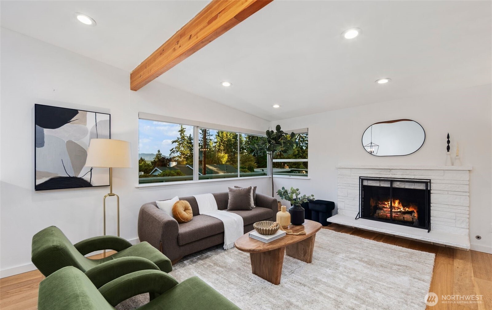 201 165th Avenue Northeast Bellevue, WA 98008 - Photo 2 of 13 a living room with furniture fireplace and window